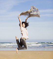 Image showing pretty happy girl jumping