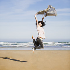 Image showing pretty happy girl jumping