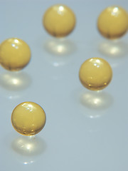 Image showing 5 yellow pills