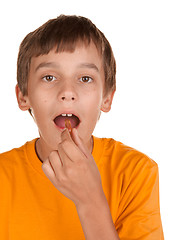 Image showing boy taking a pill