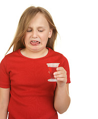 Image showing young girl taking medicine