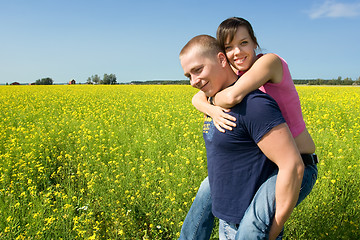 Image showing Couple smiling on a field