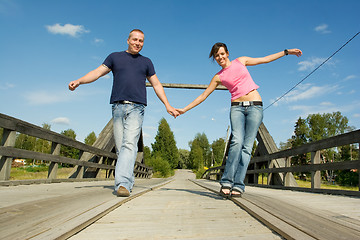 Image showing Couple having fun on bridge