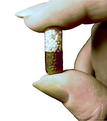 Image showing Hand and pill