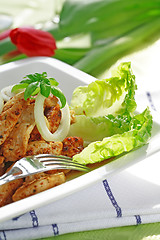 Image showing Chicken stripes with salad