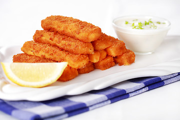 Image showing Healthy fried fish sticks with remoulade