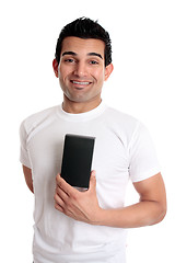 Image showing Smiling man holding retail product