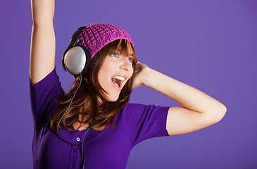 Image showing Beautiful woman listening music