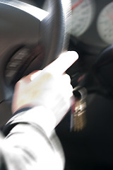 Image showing Abstract Blurry Hand on Steering Wheel