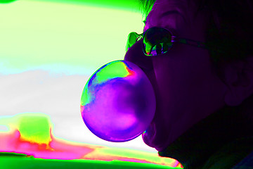 Image showing Abstract Woman Blowing Bubbles with a Bubble Gum