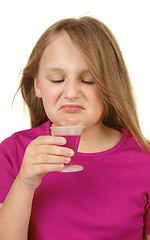 Image showing young girl taking medicine