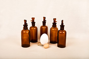 Image showing Easter eggs and rooster bottles