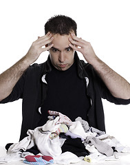 Image showing Man Sorting Laundry