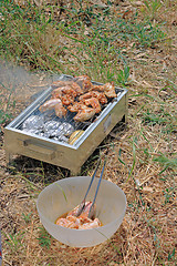 Image showing BBQ. Close up photo of cooking meet on the open fire