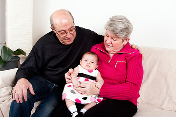 Image showing Grandparents with baby girl