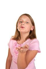 Image showing a young girl blowing a kiss