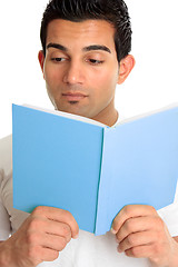 Image showing Closeup of a man reading a book