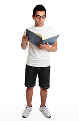 Image showing Man reading a hardcover book