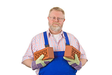 Image showing Bricklayer with two bricks