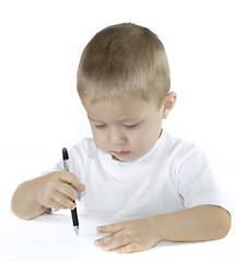 Image showing small boy is drawing isolated on white