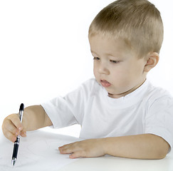Image showing small boy is drawing isolated on white