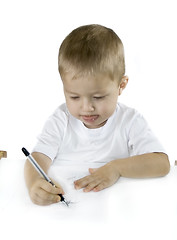 Image showing small boy is drawing isolated on white