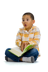 Image showing cute boy arguing over a book