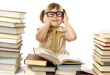 Image showing Happy little girl with books wearing black glasses