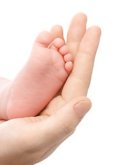Image showing Mother holding her newborn's foot