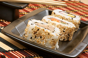 Image showing Sushi on a black tray