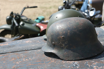 Image showing two military soldier metallic helmets