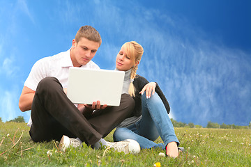Image showing young man and girl blonde with laptop