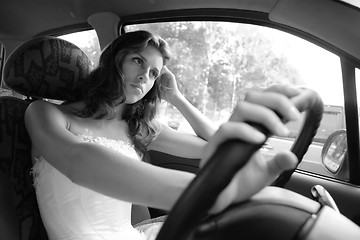 Image showing girl controls car