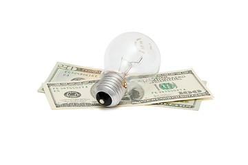 Image showing Electric bulb on dollar bills isolated