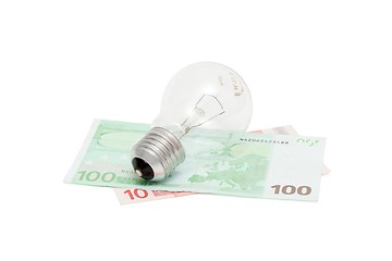 Image showing Electric bulb on euro bills isolated