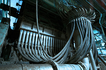 Image showing Pipes, tubes, machinery and steam turbine at a power plant
