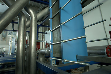 Image showing Pipes, tubes, machinery and steam turbine at a power plant