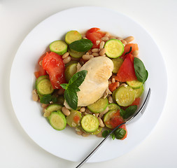 Image showing Italian chicken with courgettes and beans from above