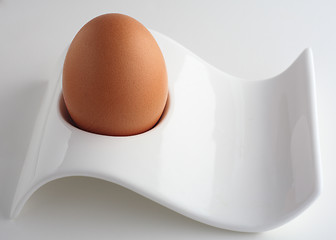 Image showing Brown egg in modernist eggcup