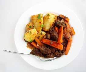 Image showing Plate of beef and carrot stew from above