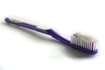 Image showing Toothbrush and toothpaste with shadow