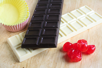 Image showing Chocolate cherries and cake cups