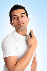 Image showing Man with aftershave cologne perfume