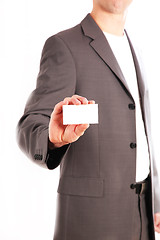 Image showing A business man holding his unmarked business card into the camer