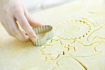 Image showing Cutting out cookies from dough