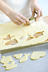 Image showing Cutting cookies from dough