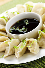 Image showing Steamed dumplings and soy sauce