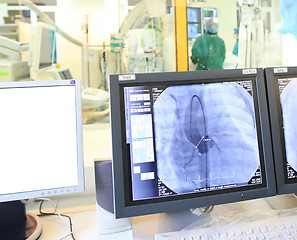 Image showing Doctor looking at a computer monitor