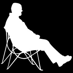 Image showing man sitting on black background