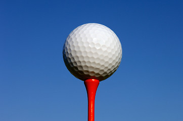 Image showing White Golf Ball on Red Tee